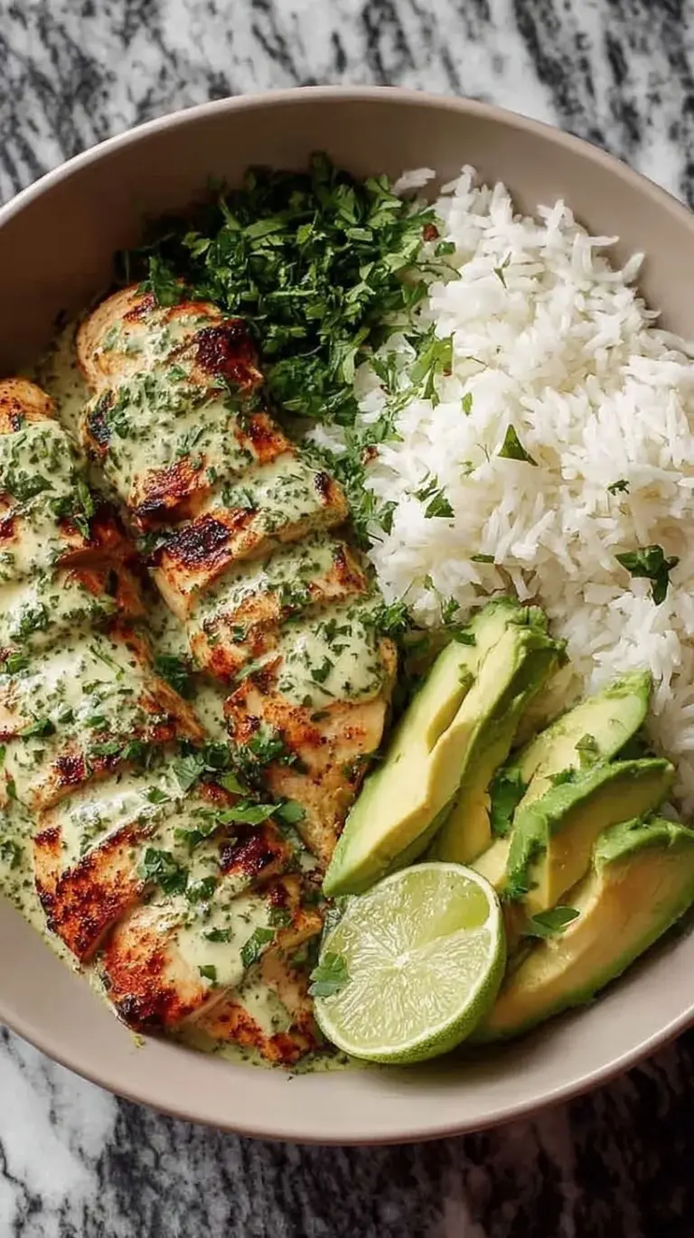 Seared cilantro lime chicken strips served over jasmine rice with sliced avocado and lime wedges.