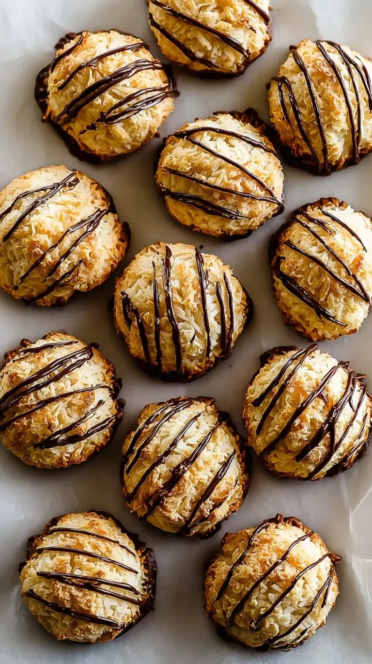 Golden brown chewy coconut macaroons piled on a white serving platter