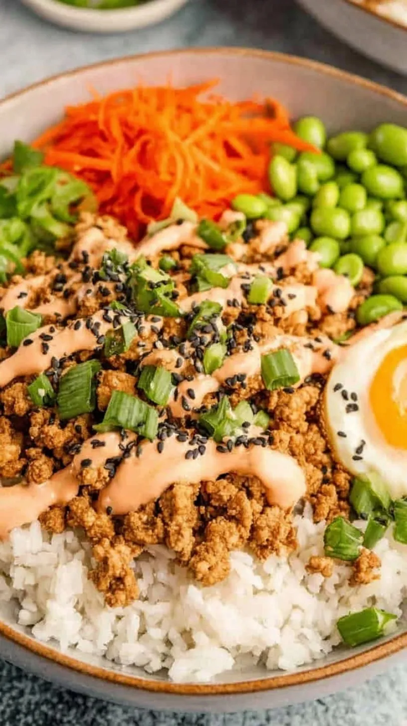 A close-up shot of a Ground Turkey Rice Bowl with colorful peppers and green onions over white rice.