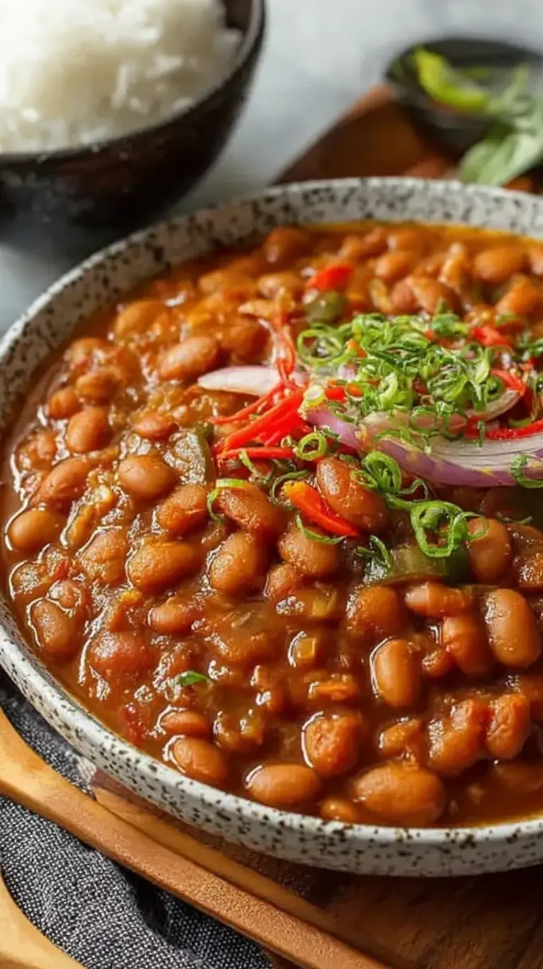 A steaming bowl of Japanese-style pinto bean stew with carrots and shiitake mushrooms