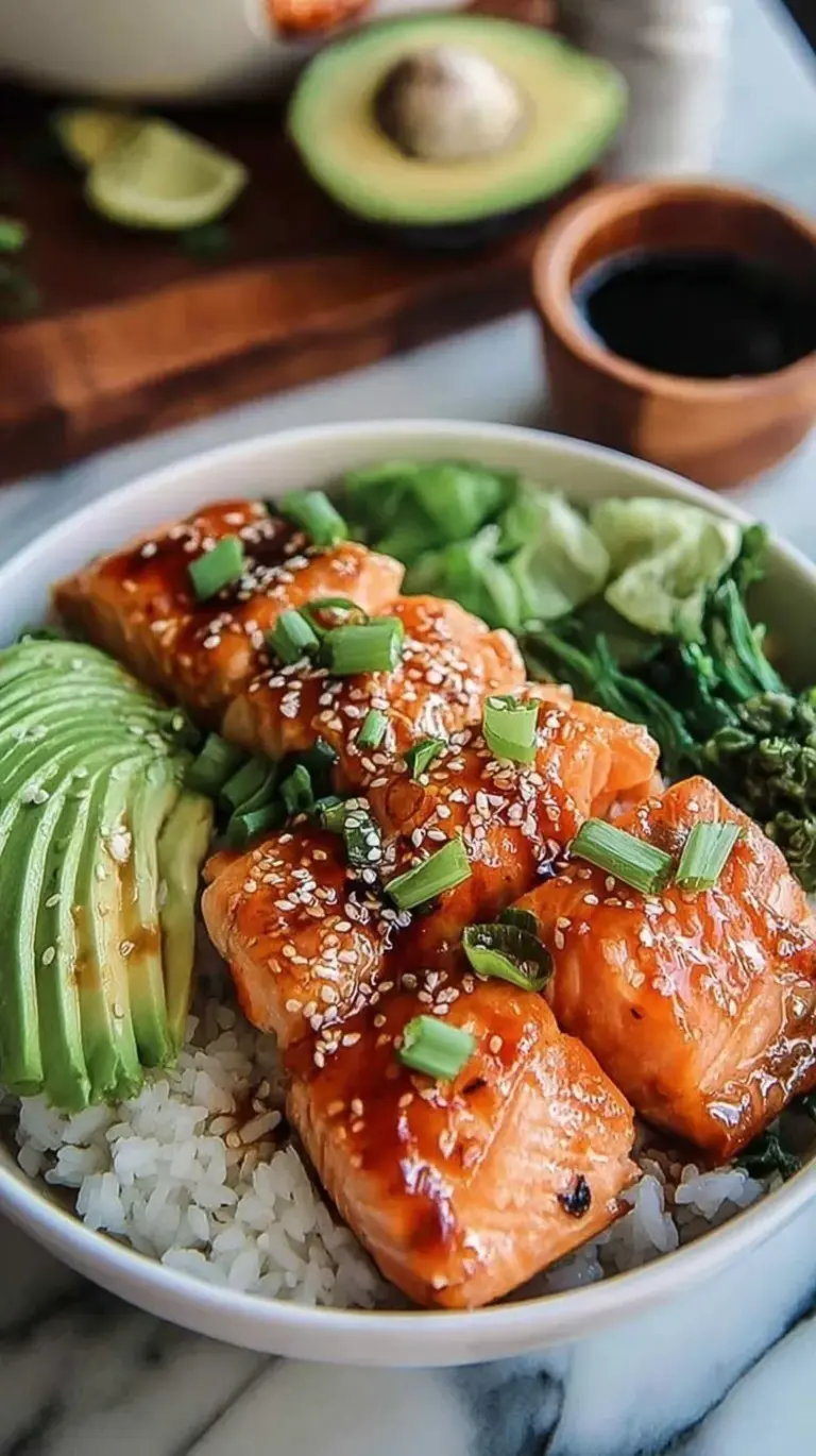 A vibrant salmon rice bowl with seared salmon, sliced avocado, cucumbers, and a drizzle of spicy mayo.