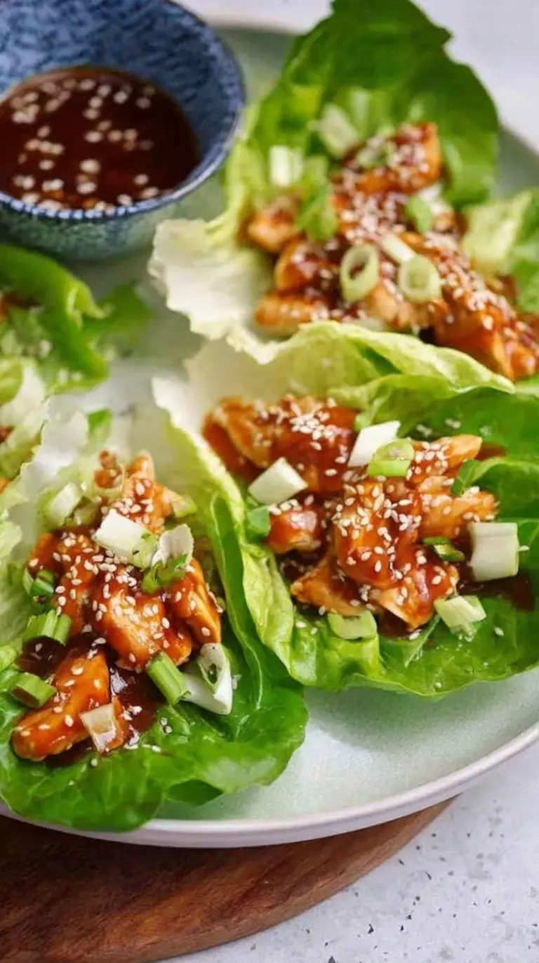Fresh butter lettuce leaves filled with savory teriyaki ground chicken and topped with green onions